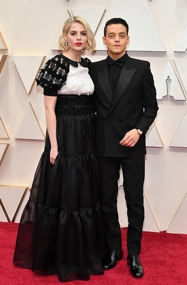 Lucy Boynton in Chanel, Rami Malek in Yves Saint Laurent